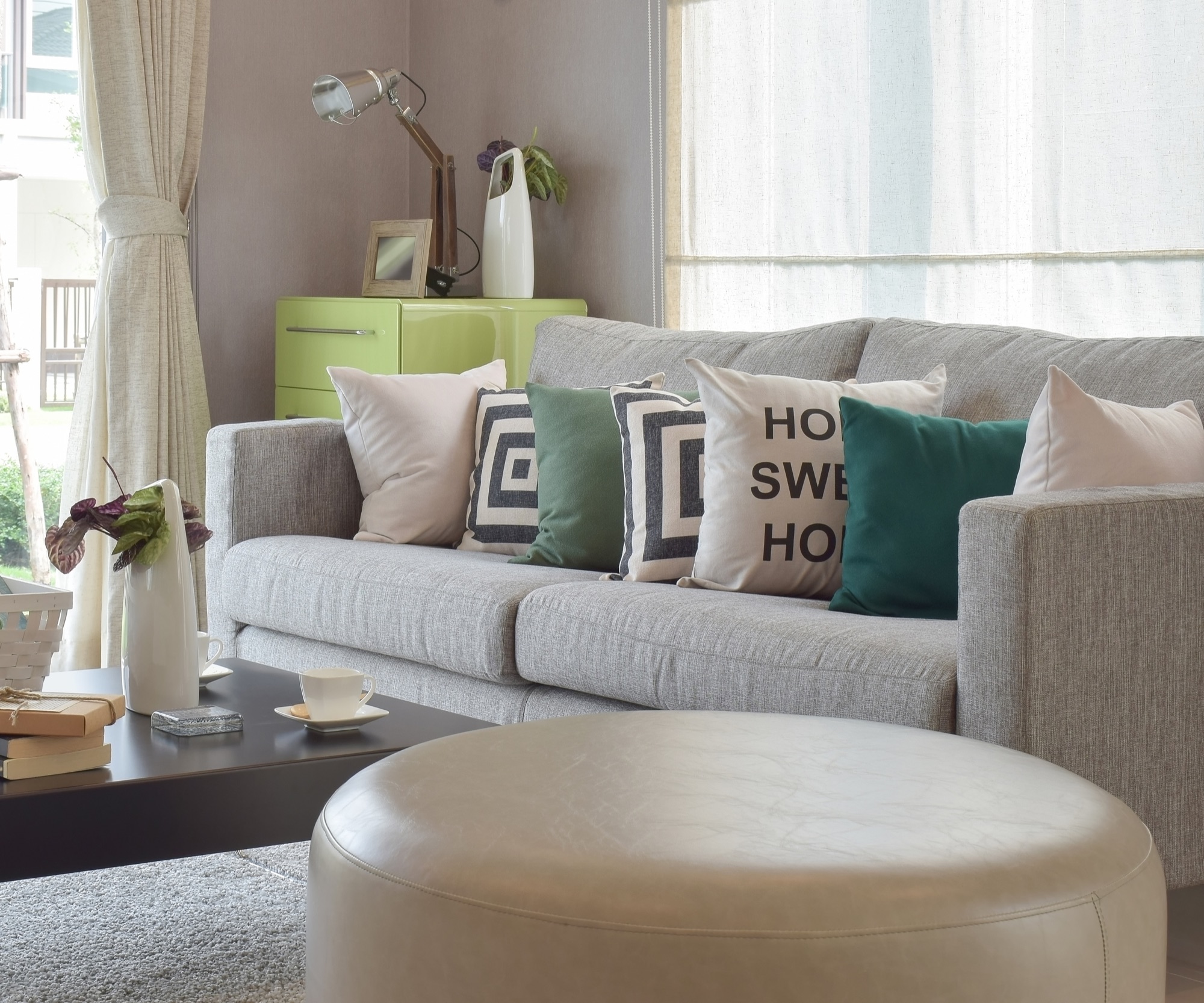 Bright living room with a sofa and pillows